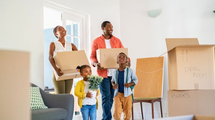 family of four moving into a home